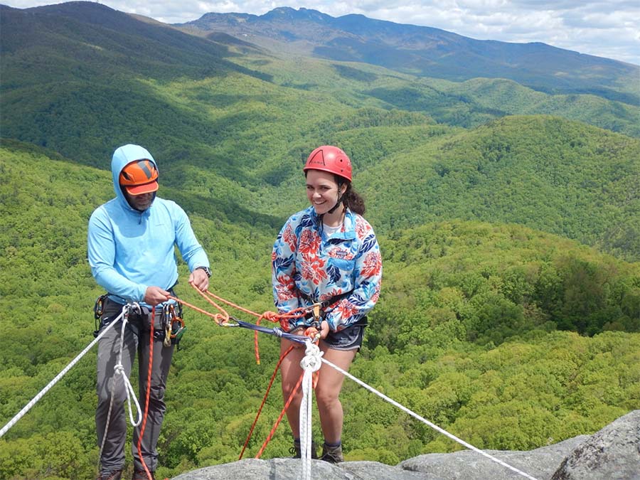 Blog - Gym to Crag Risk Management with Granite Insurance - Appalachian Mountain Leadership Helping Student At The Top Of The Climbing Rock