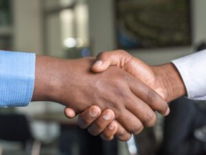 Two people shaking hands.